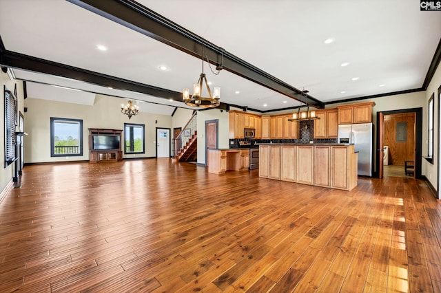 kitchen with crown molding, decorative light fixtures, beamed ceiling, stainless steel appliances, and light hardwood / wood-style floors