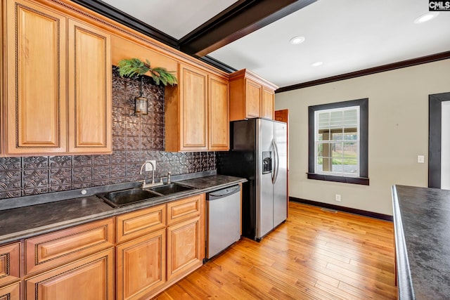 kitchen featuring sink, backsplash, ornamental molding, stainless steel appliances, and light wood-type flooring