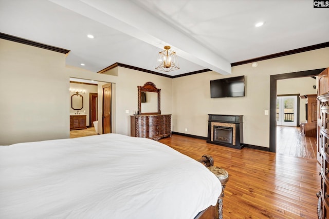 bedroom with ornamental molding, beam ceiling, a chandelier, and hardwood / wood-style floors