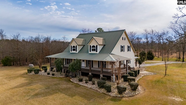 view of front facade featuring covered porch and a front lawn