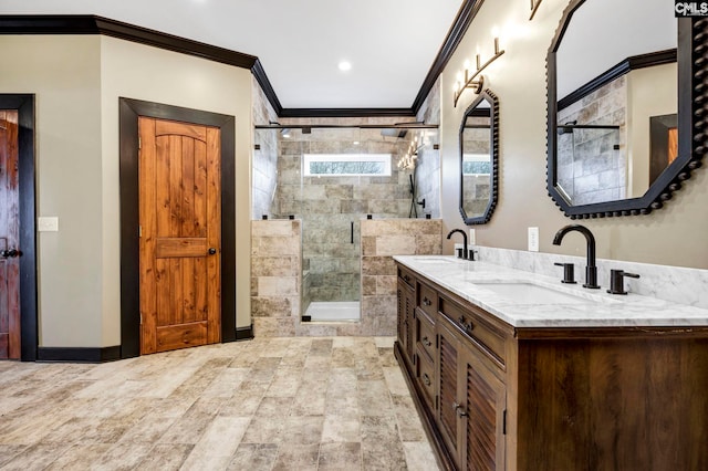 bathroom with vanity, crown molding, and a shower with shower door