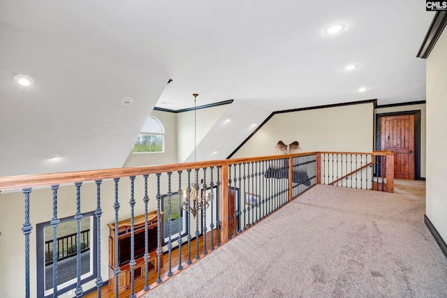 hallway featuring ornamental molding and carpet floors