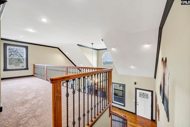 stairs featuring ornamental molding and plenty of natural light