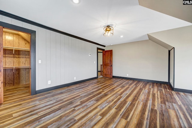 unfurnished room with ornamental molding and dark hardwood / wood-style floors