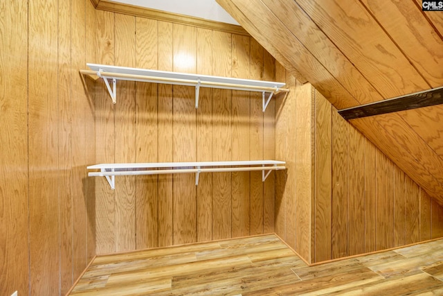 spacious closet with light hardwood / wood-style flooring