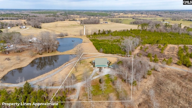 drone / aerial view with a water view and a rural view