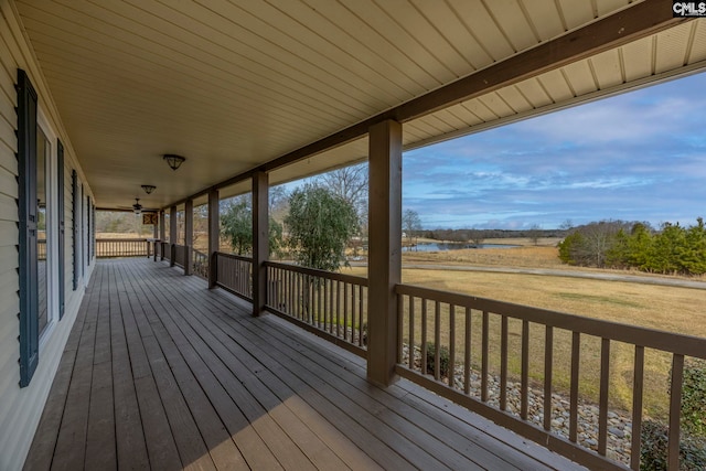 wooden deck featuring a yard