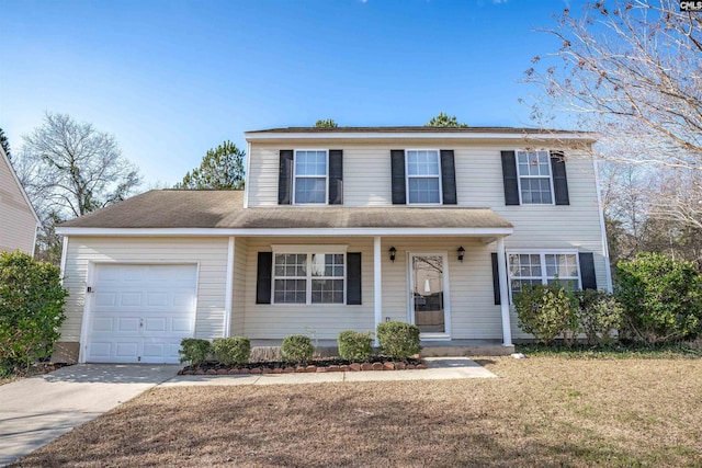 view of front of property with a garage, a front lawn, and covered porch