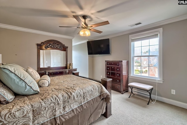 carpeted bedroom featuring ornamental molding and ceiling fan