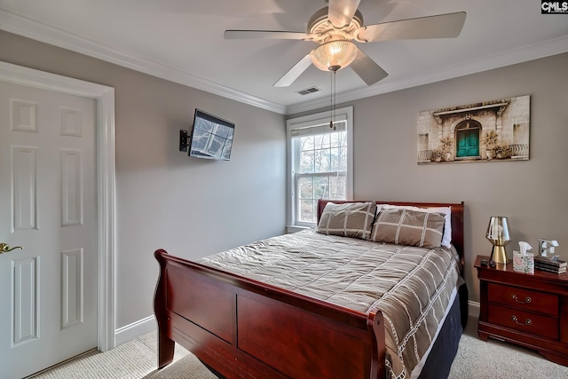 bedroom with crown molding, light colored carpet, and ceiling fan