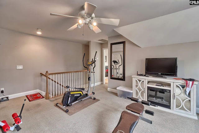 exercise area with light carpet and ceiling fan