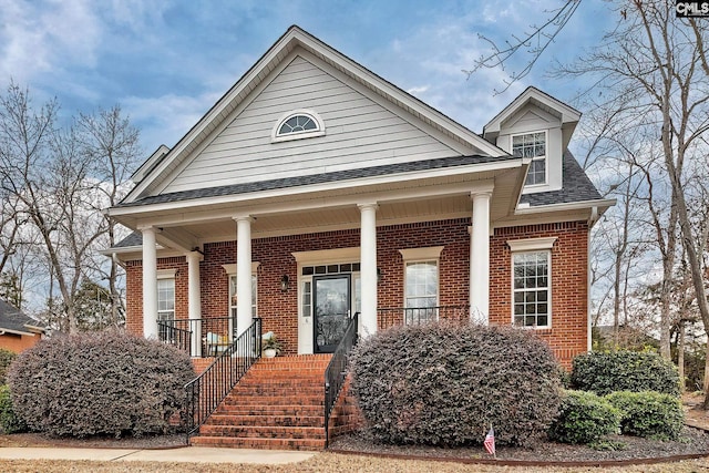 view of front of property featuring covered porch