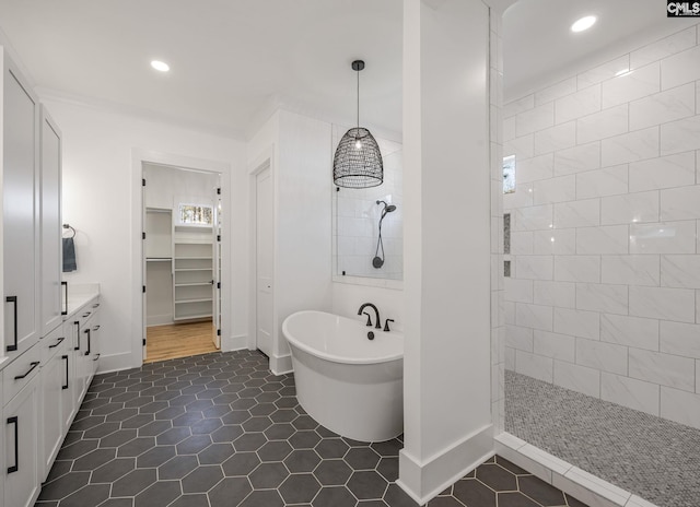 bathroom with tile patterned floors, plus walk in shower, and vanity