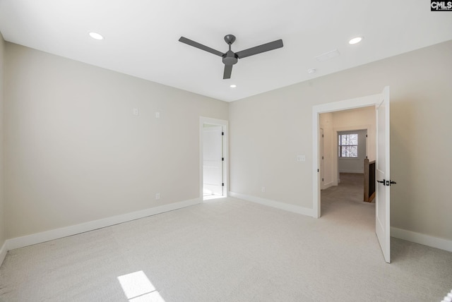 unfurnished bedroom with ceiling fan and light colored carpet