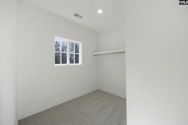 spare room with light colored carpet