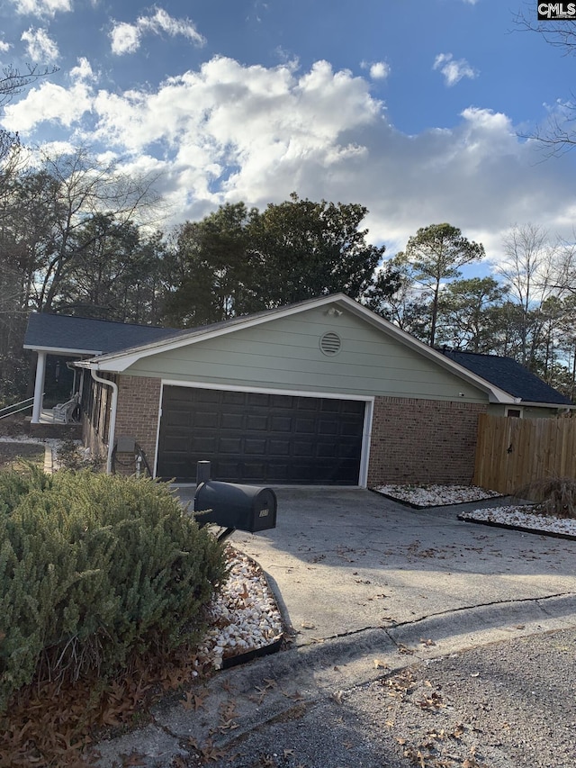 view of side of property with a garage