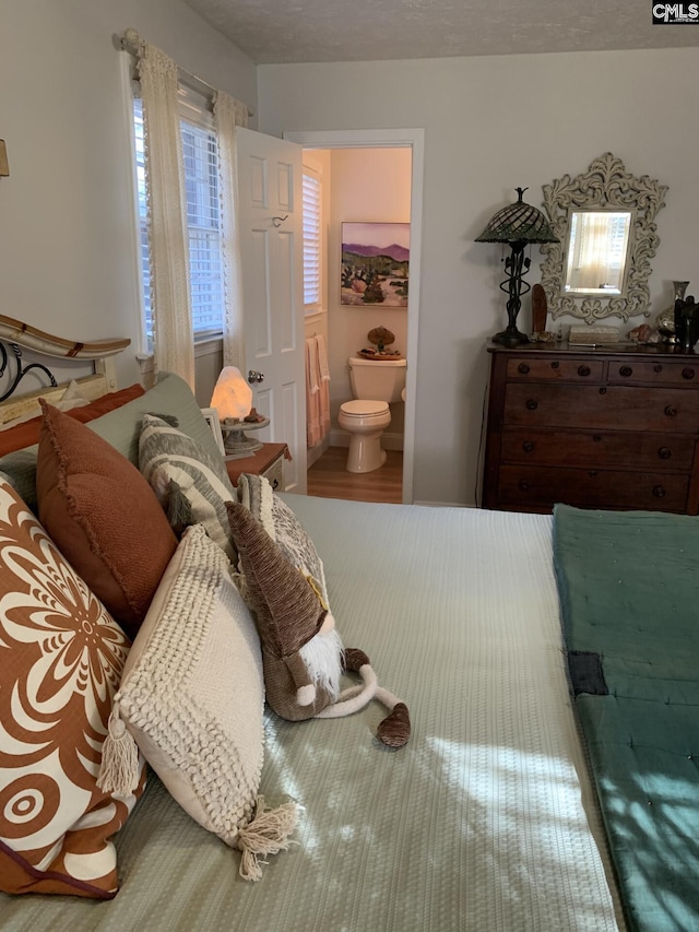 bedroom featuring connected bathroom