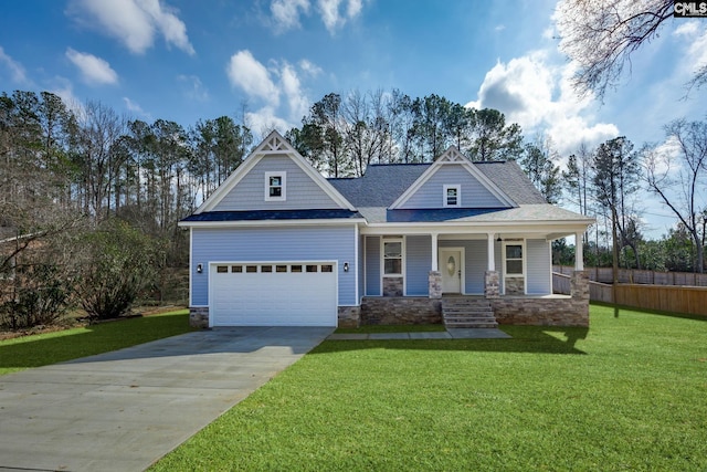 craftsman-style house with a garage, a porch, and a front yard