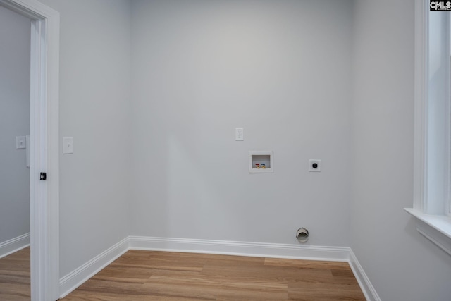 washroom with hardwood / wood-style floors, electric dryer hookup, and washer hookup