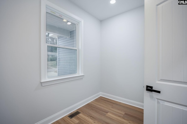 spare room with light hardwood / wood-style flooring