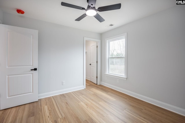 unfurnished bedroom featuring light hardwood / wood-style flooring and ceiling fan