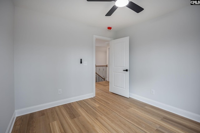 spare room featuring ceiling fan and light hardwood / wood-style flooring