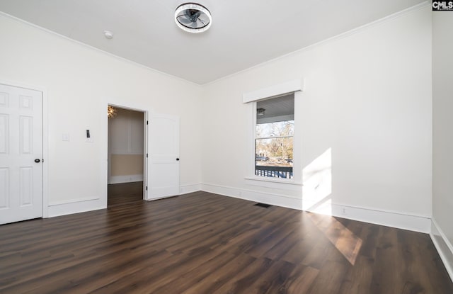 unfurnished room featuring crown molding and dark hardwood / wood-style floors