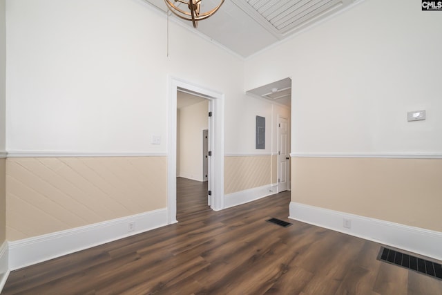 unfurnished room with dark wood-type flooring