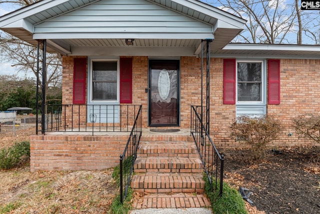 property entrance featuring covered porch