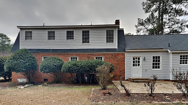 back of house featuring a yard and a patio area