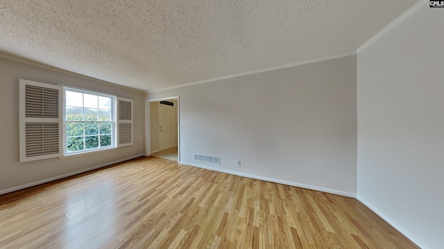 unfurnished room with ornamental molding, light hardwood / wood-style floors, and a textured ceiling