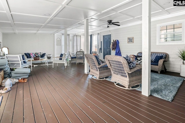 deck featuring an outdoor living space and ceiling fan