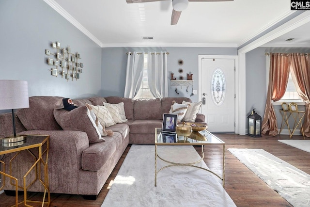 living room featuring crown molding, dark hardwood / wood-style floors, and ceiling fan