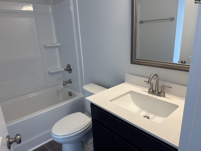 bathroom with toilet, shower / washtub combination, and vanity