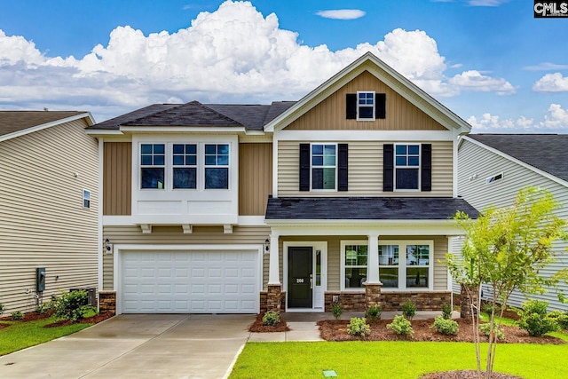 craftsman inspired home featuring an attached garage, board and batten siding, and concrete driveway