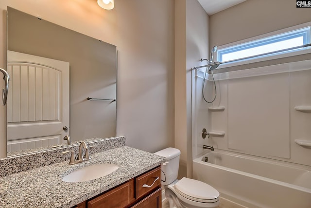 full bathroom with vanity, toilet, and washtub / shower combination