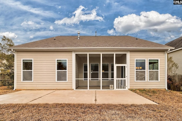 rear view of property with a patio and a sunroom