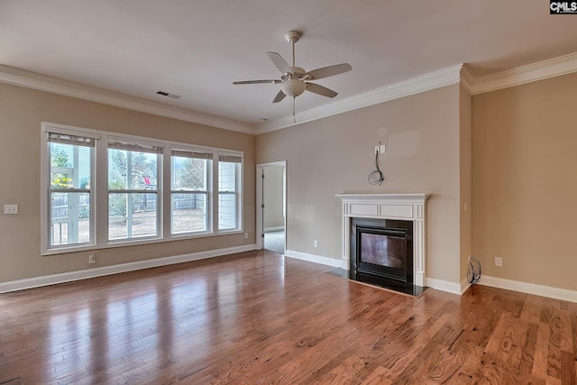 unfurnished living room with hardwood / wood-style flooring, ceiling fan, and crown molding