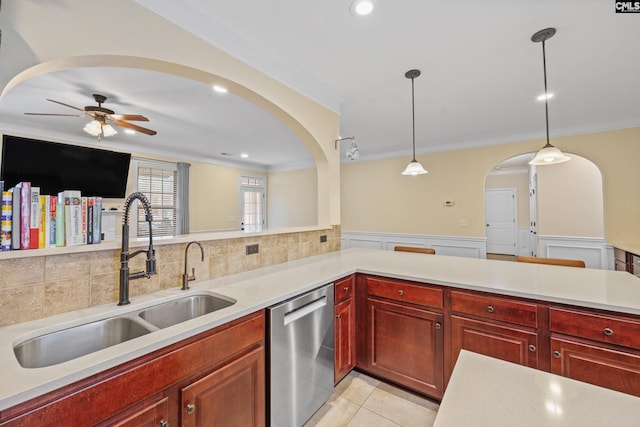 kitchen with sink, crown molding, dishwasher, hanging light fixtures, and light tile patterned flooring