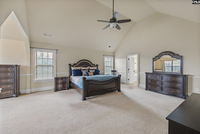 carpeted bedroom featuring ceiling fan and high vaulted ceiling