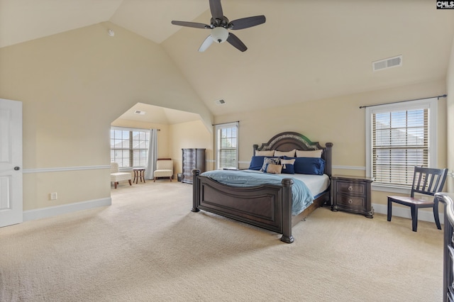 bedroom with high vaulted ceiling, light colored carpet, and ceiling fan