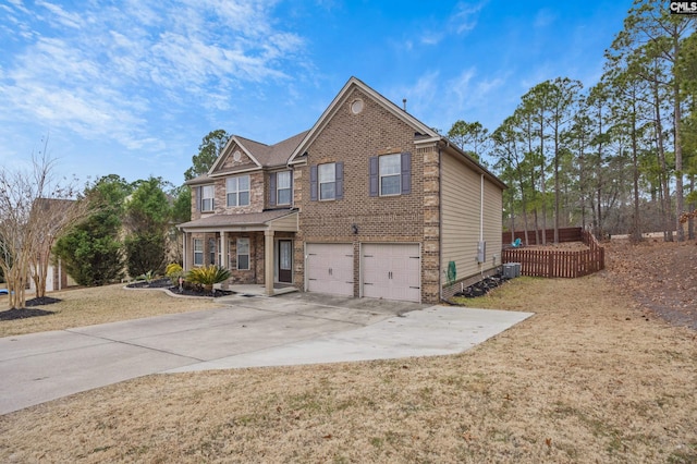 view of front facade with a porch, a garage, and a front yard