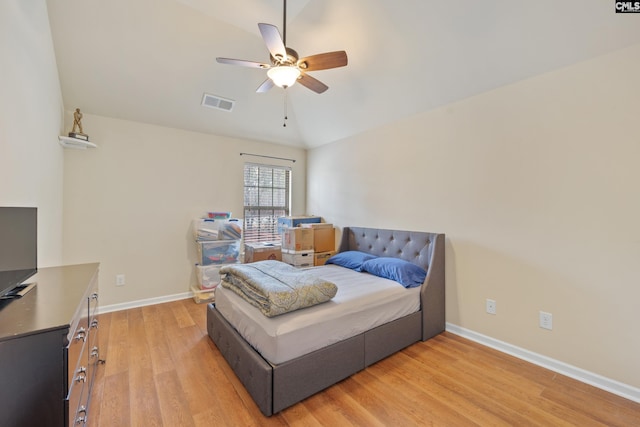 bedroom featuring vaulted ceiling, ceiling fan, and light hardwood / wood-style flooring