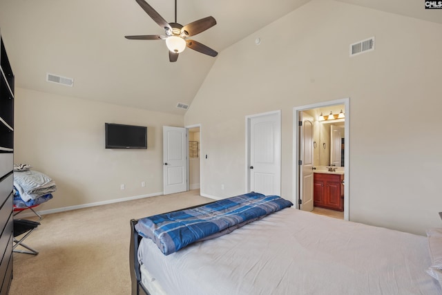 bedroom featuring connected bathroom, high vaulted ceiling, sink, light colored carpet, and ceiling fan