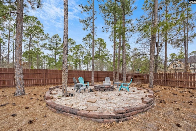 view of yard with an outdoor fire pit