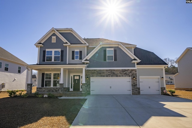 craftsman-style house with a garage and covered porch