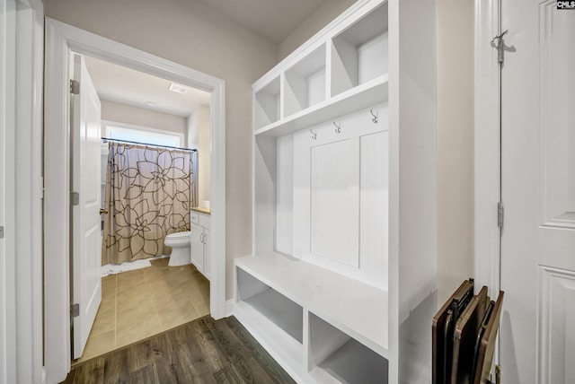 mudroom featuring dark wood-type flooring