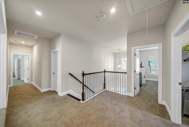 hallway with carpet floors