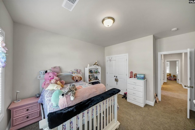 carpeted bedroom featuring a closet