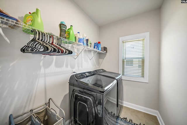 laundry room featuring washer and dryer and tile patterned floors